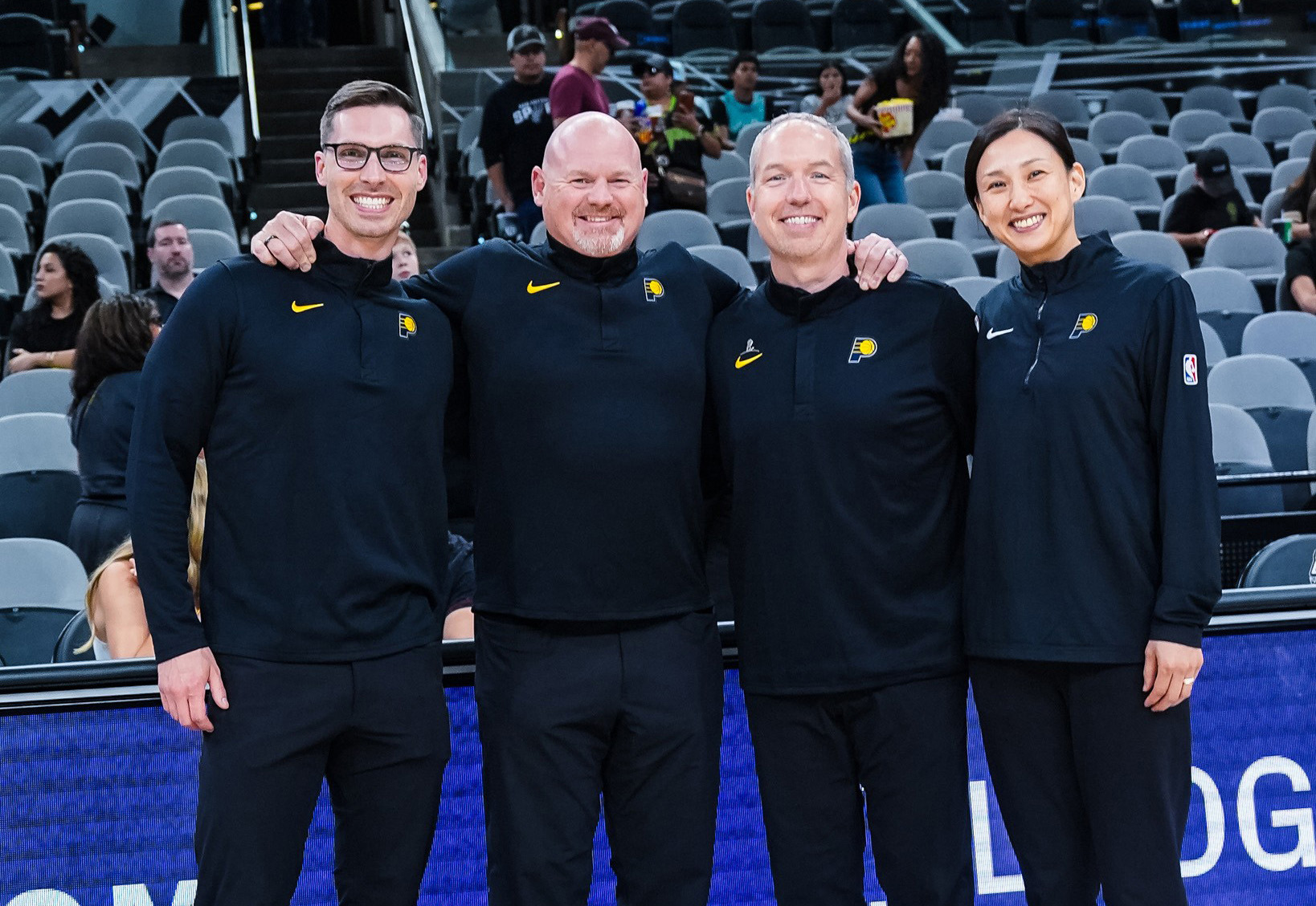 Ayami Sato is pictured with other members of the Indiana Pacers sports medicine team.
