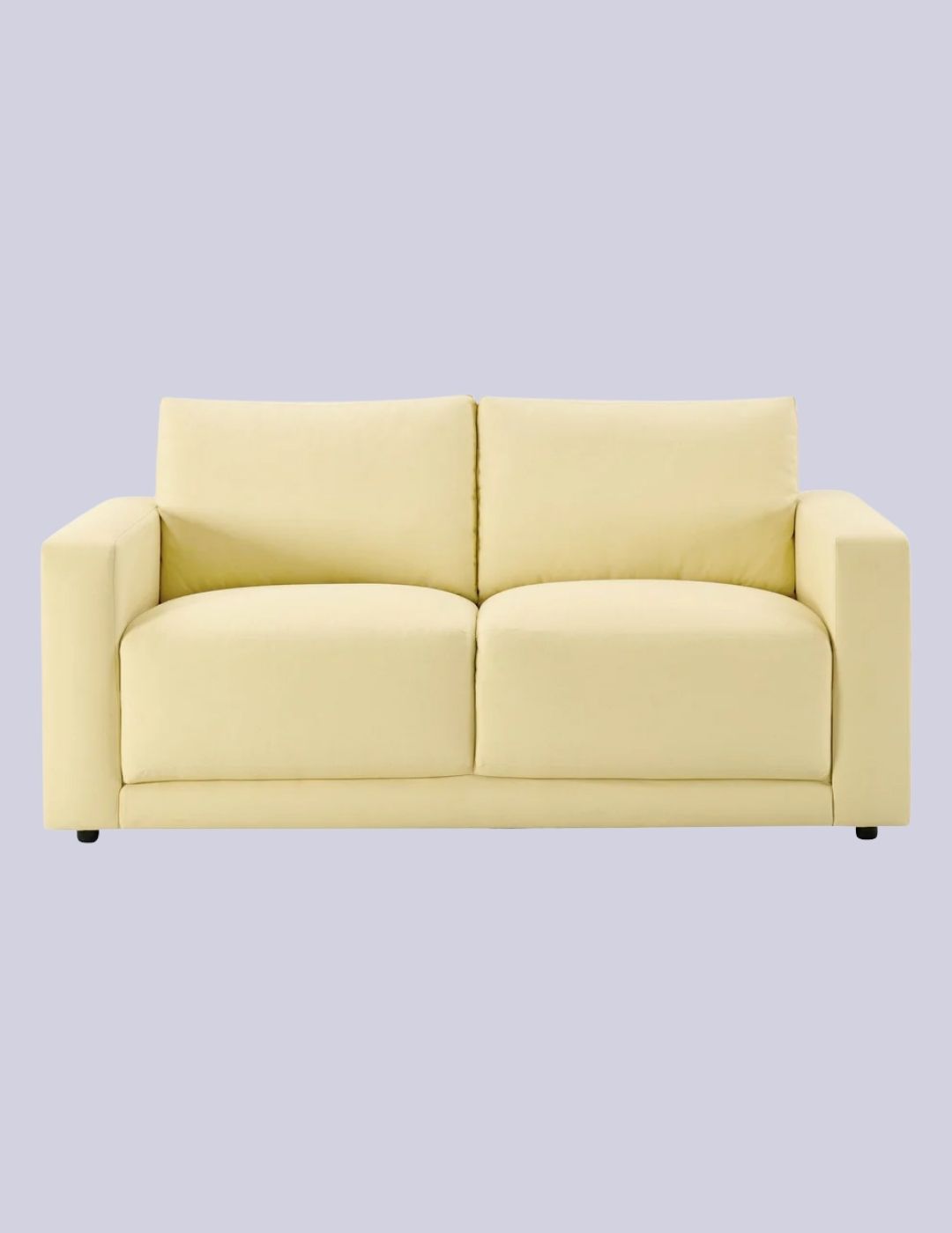 DUSK Chicago 2 Seater Sofa in Butter Yellow against pale lilac background.
