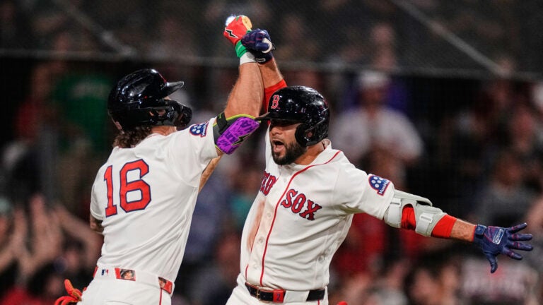 Boston Red Sox's Isiah Kiner-Falefa, right, celebrates with Jarren Duran (16) after his solo home run during the sevent inning of a baseball game against the Atlanta Braves', Tuesday, May 26, 2026, in Boston.