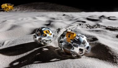 An illustration of two metal rounded objects on the moon's surface.