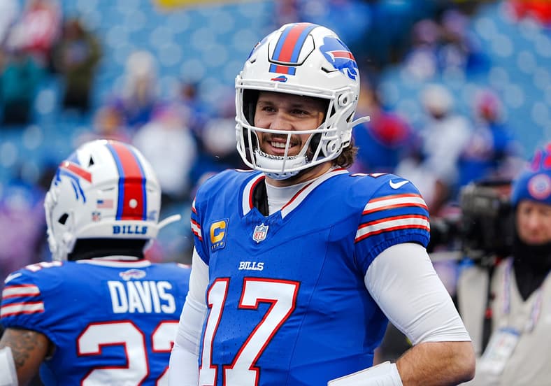 Buffalo Bills quarterback Josh Allen (17) smiles at something someone said before the Buffalo Bills wild card game against the
