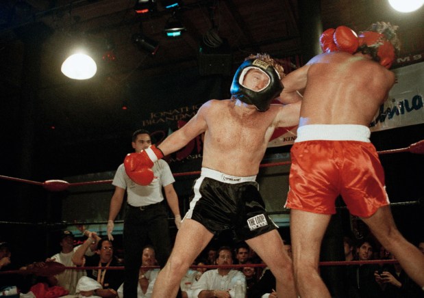 Danny Bonaduce, left, and Donny Osmond duke it out during fight in Chicago, Jan. 17, 1994. (Tim Boyle/AP)