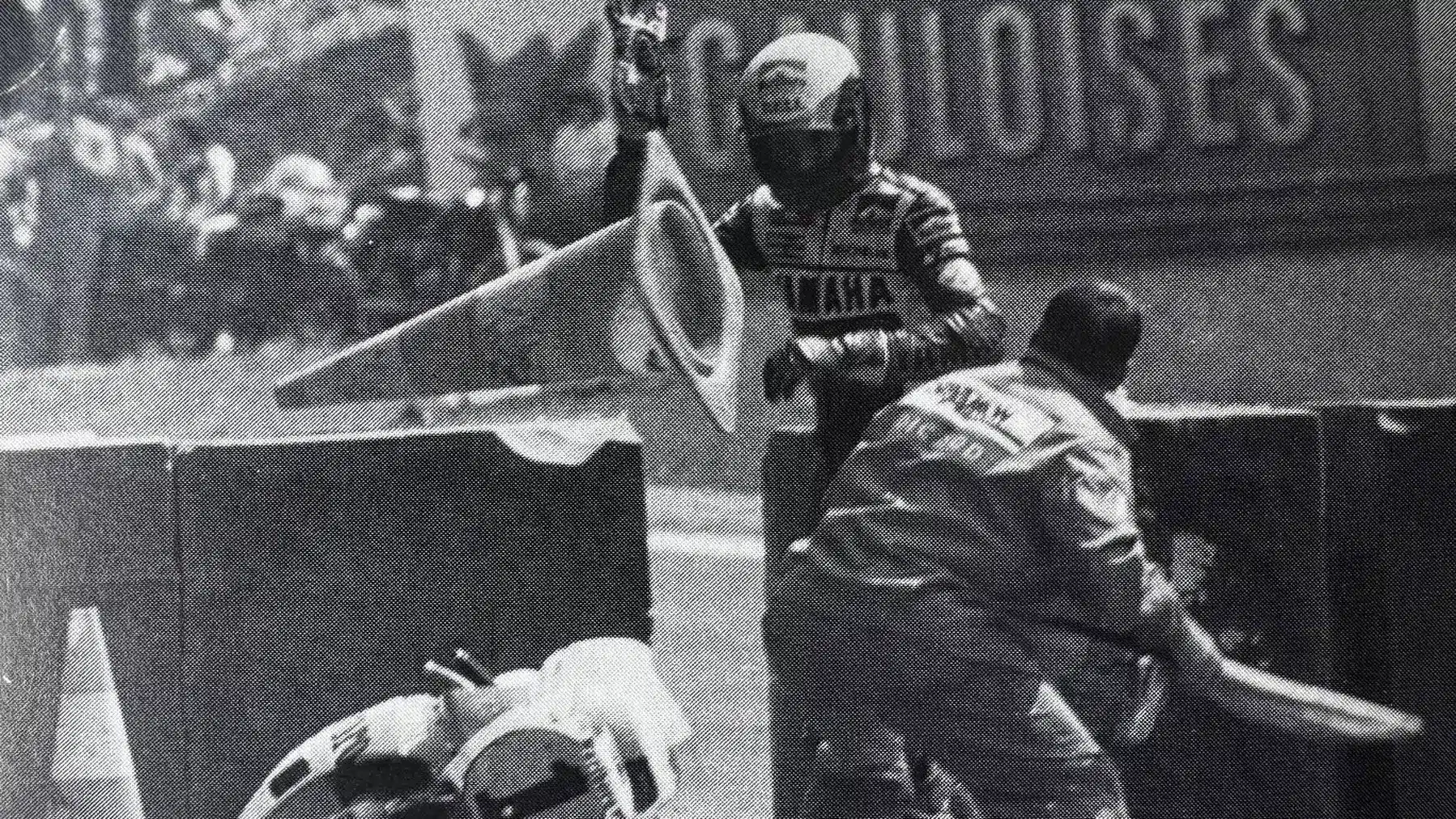 Lawson lobs at traffic cone at a marshal during the 1985 Belgian GP