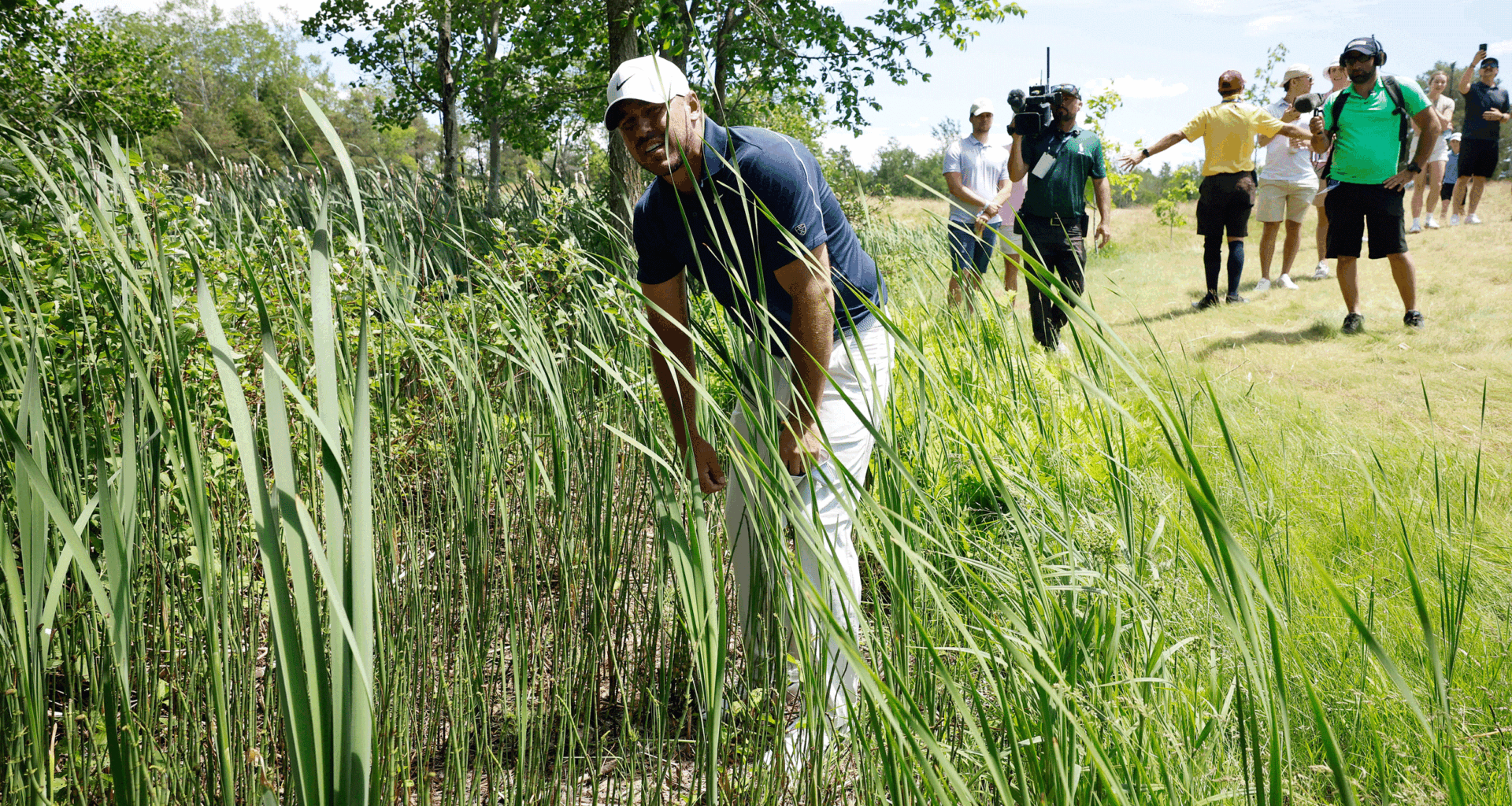 Brooks Koepka hunts for a lost ball during round three of the 2026 RBC Canadian Open