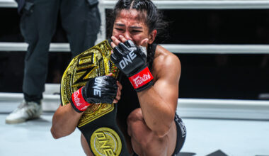 Denice Zamboanga in tears after capturing the interim atomweight MMA world title against Alyona Rassohyna.