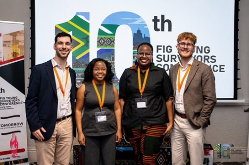 Four young surveyors standing next to each other