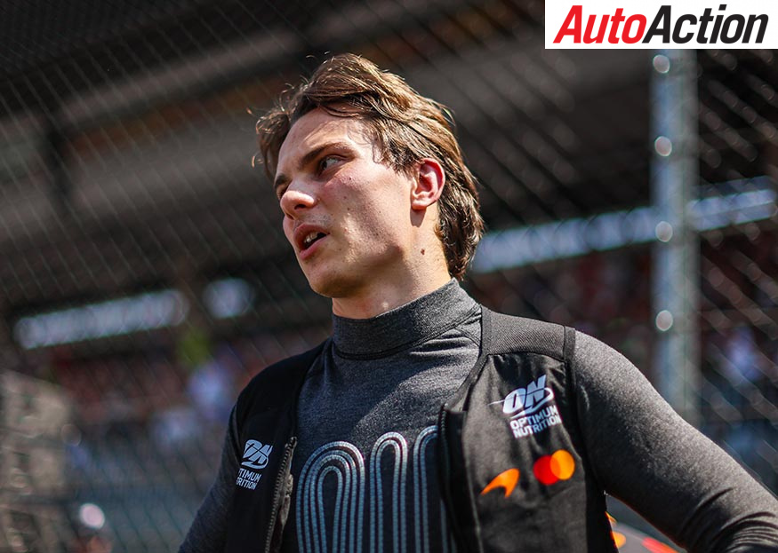 Oscar Piastri looks off-camera in his McLaren cool vest and team kit at the Red Bull Ring during the 2026 Austrian Grand Prix weekend