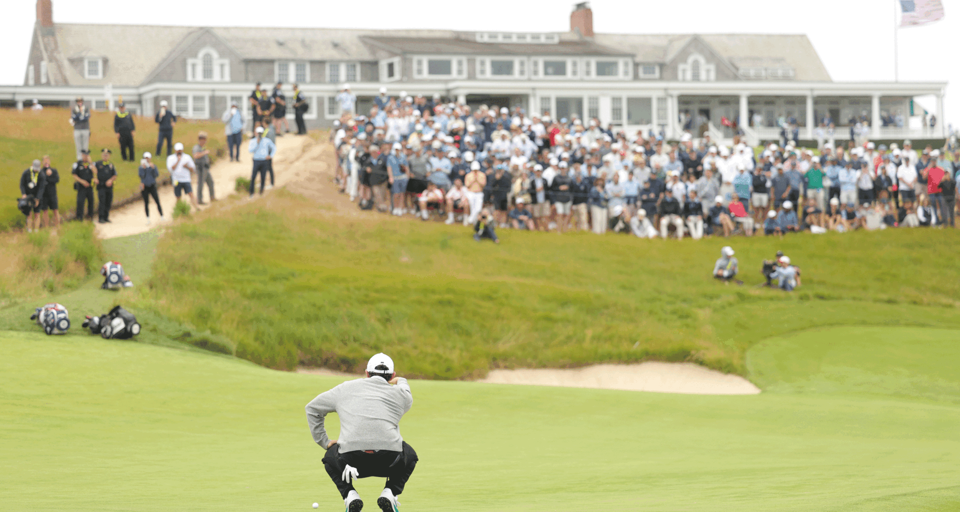 Rory McIlroy lines up a putt on the 18th green at Shinnecock Hills during round one of the 2026 US Open