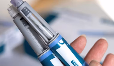 person holding GLP-1 injection pens
