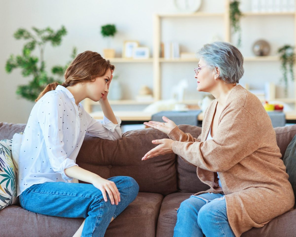 Conflict of family two generations old mother and adult daughter - stock photo