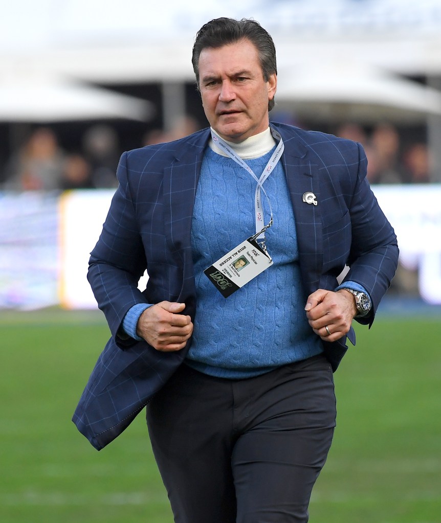 Dr. Neal Elattrache, Team Physician for the Los Angeles Rams, wearing a blue blazer and light blue sweater, with his "2019 All Access" NFL pass visible.