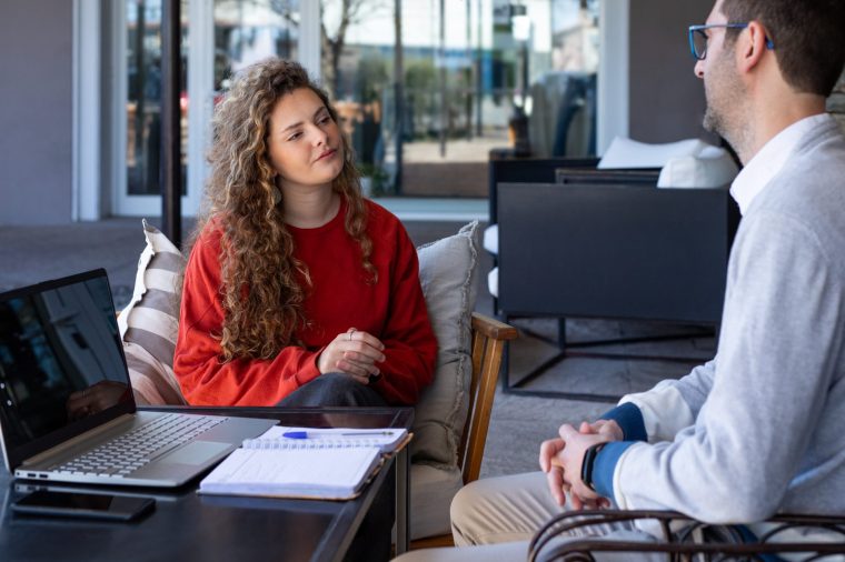 Young woman at her first job interview with the owner of a coffee shop - stock photo