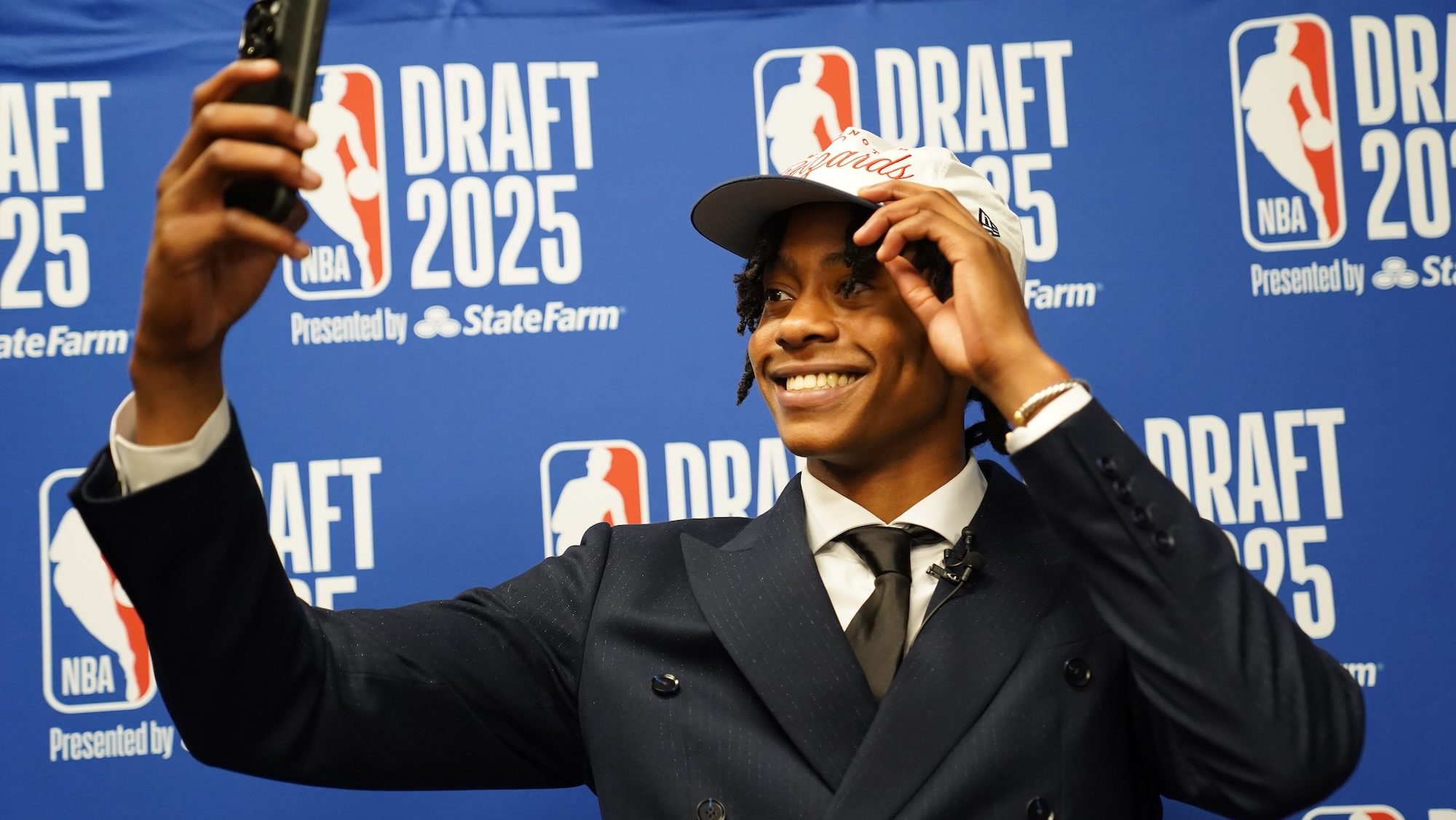‘I feel like we both got drafted today’: Wizards' pick Tre Johnson, formerly 'worst critic' dad share moment - Andscape