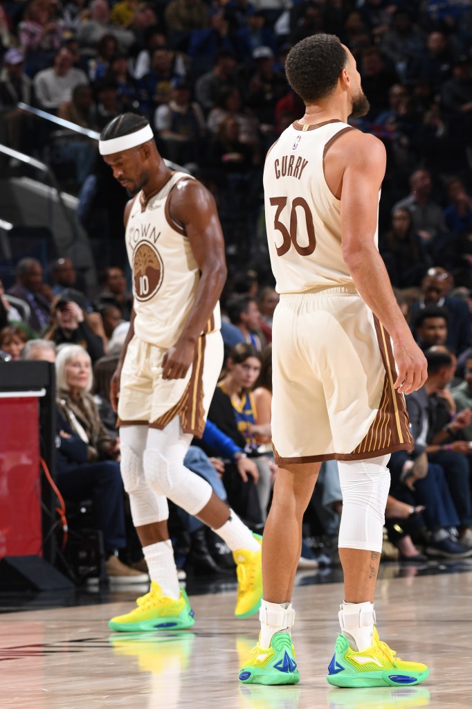 Stephen Curry (right) and Jimmy Butler III (left) of the Golden State Warriors