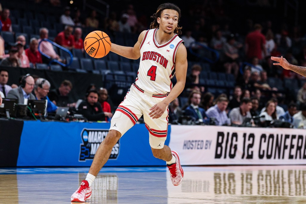 Houston Cougars player Jamal Shead dribbles the basketball in a NCAA Men's Basketball Tournament game.