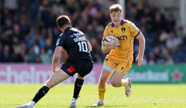 Fin Smith of Northampton Saints takes on Harvey Skinner of Exeter Chiefs during the Gallagher PREM match in April 2026.