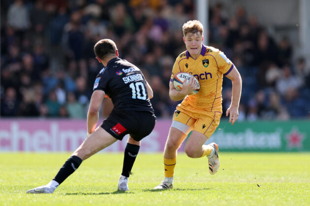 Fin Smith of Northampton Saints takes on Harvey Skinner of Exeter Chiefs during the Gallagher PREM match in April 2026.