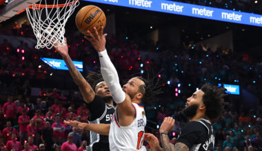 Jalen Brunson #11 of the New York Knicks shoots the ball between Stephon Castle #5 and Julian Champagnie #30 of the San Antonio Spurs during the fourth quarter in Game One of the 2026 NBA Finals at Frost Bank Center on June 03, 2026 in San Antonio, Texas.