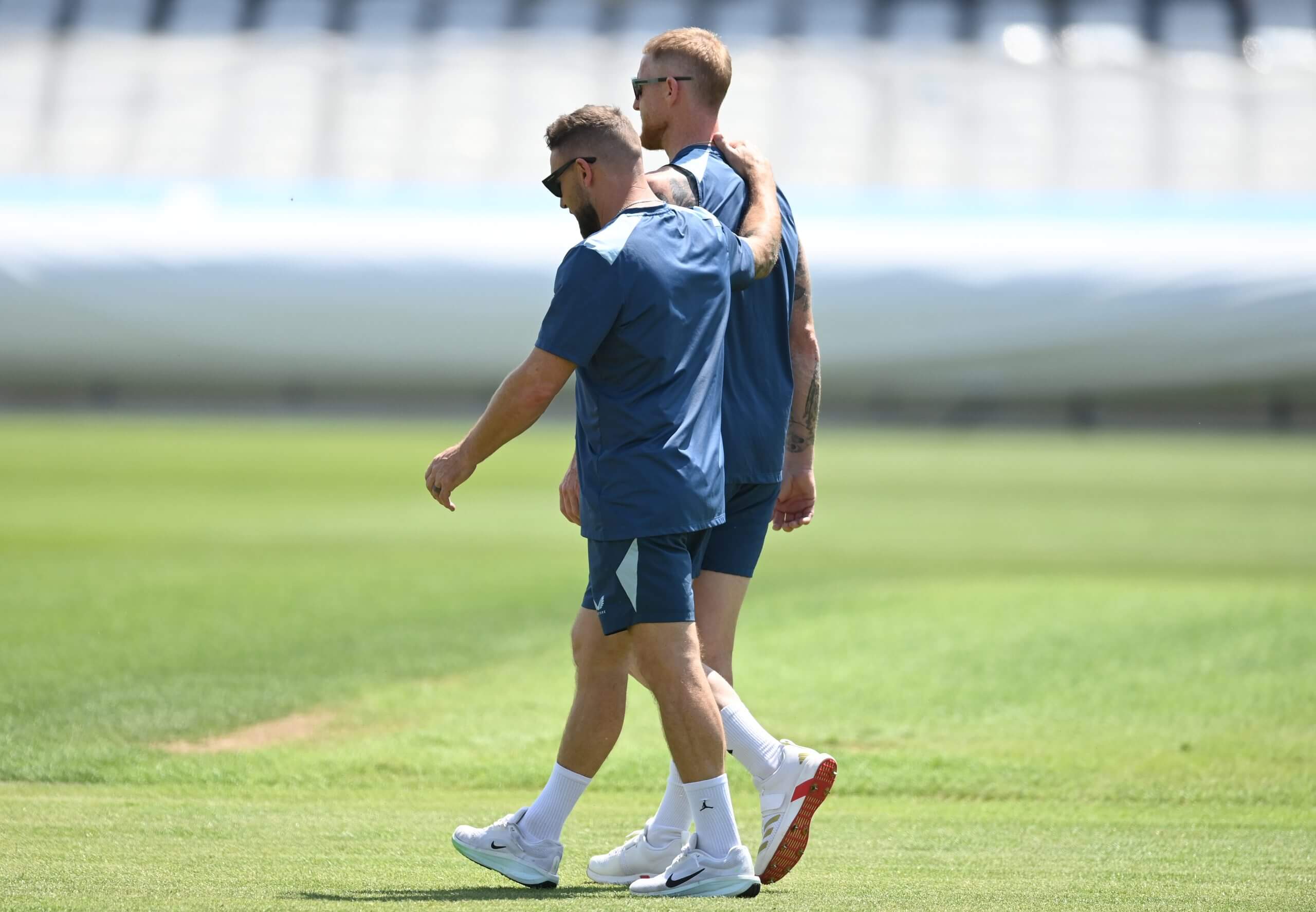 Brendon McCullum and Ben Stokes walk across the ground ahead of an England training session at Trent Bridge