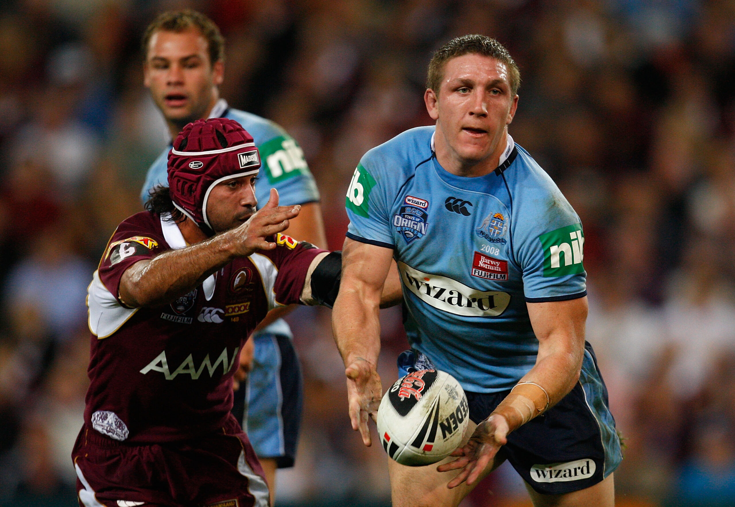 BRISBANE, AUSTRALIA - JUNE 11: Ryan Hoffman of the Blues offloads the ball during match two of the ARL State of Origin series between the Queensland Maroons and the New South Wales Blues at Suncorp Stadium on June 11, 2008 in Brisbane, (Photo by Cameron Spencer/Getty Images)