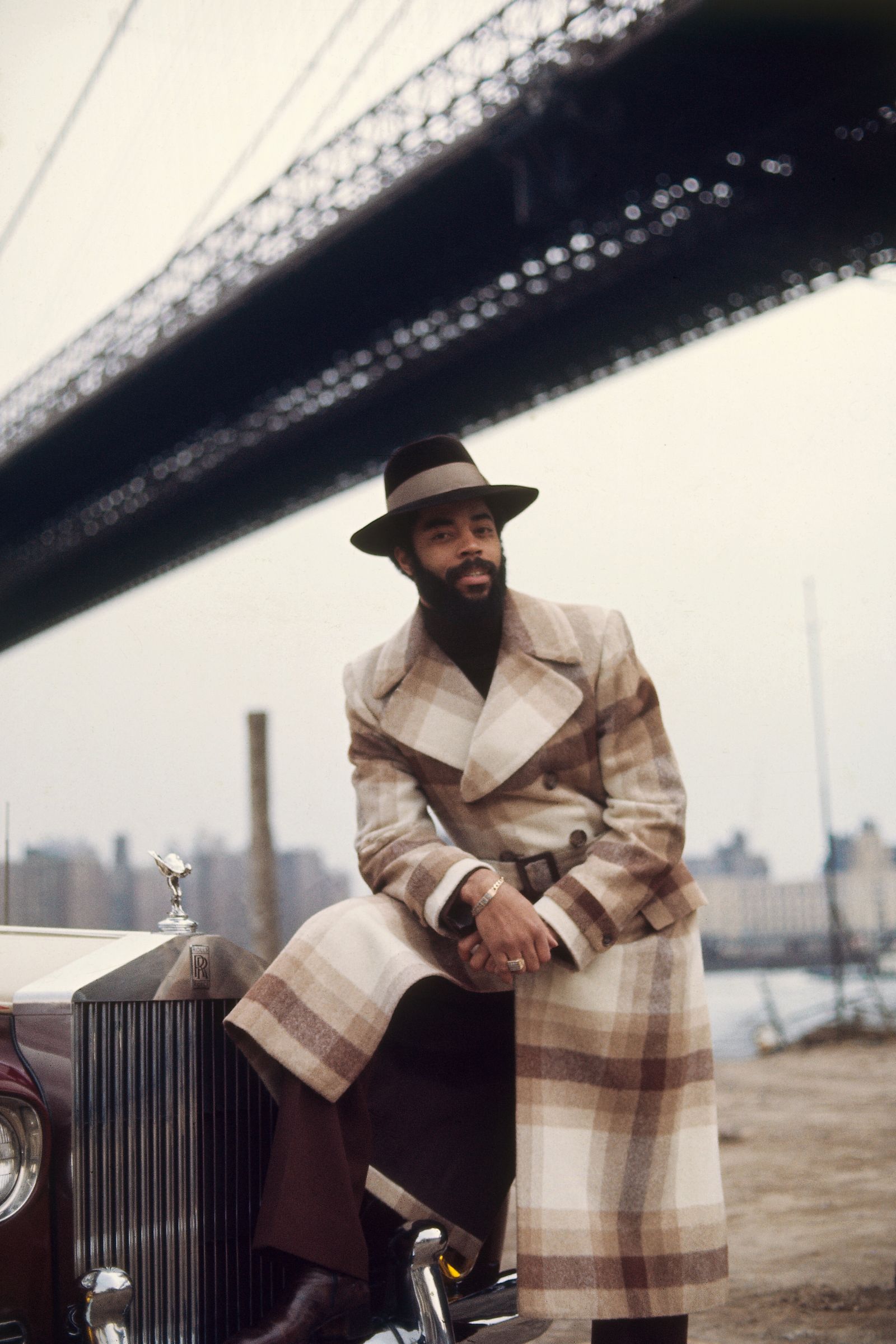 Image may contain Walt Frazier Clothing Coat Face Head Person Photography Portrait Blazer Jacket and Adult