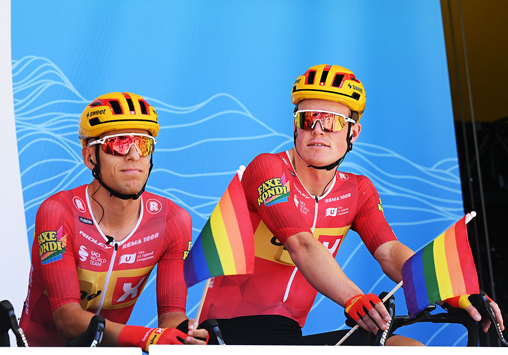 BEAUFORT, FRANCE - JUNE 14: (L-R) Tobias Halland Johannessen of Norway, Anders Skaarseth of Norway and Team Uno-X Mobility riders displays an LGBT+ flag prior to the 78th Tour Auvergne-Rhone-Alpes 2026, Stage 8 a 120.1km stage from Beaufort to Plateau de Solaison - Brison 1497m / #UCIWT / on June 14, 2026 in Beaufort, France. (Photo by Dario Belingheri/Getty Images)