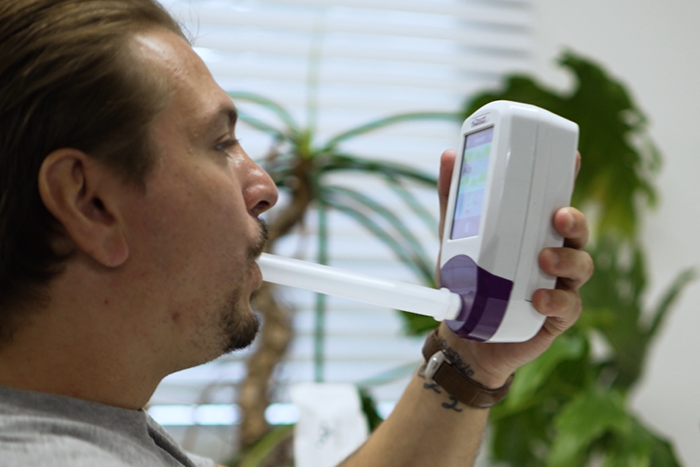 Man using the NObreath device