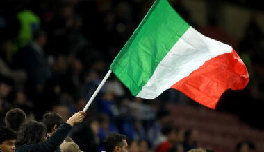 MILAN, ITALY - MARCH 20: An Italian flag is waved by a fan prior to the UEFA Nations League quarterfinal leg one match between Italy and Germany at Stadio San Siro on March 20, 2025 in Milan, Italy. (Photo by Alex Grimm/Getty Images)
