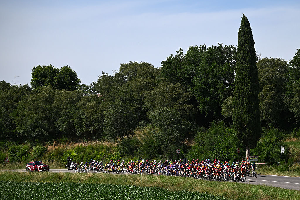 The peloton during stage 6 of the 2026 Giro d'Italia Women, a 160km stage from Ala to Brescello, Italy. (Photo by Luc Claessen/Getty Images)
