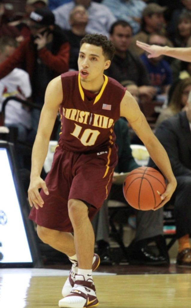 Jose Alvarado dribbles during one of his high school games at Christ the King