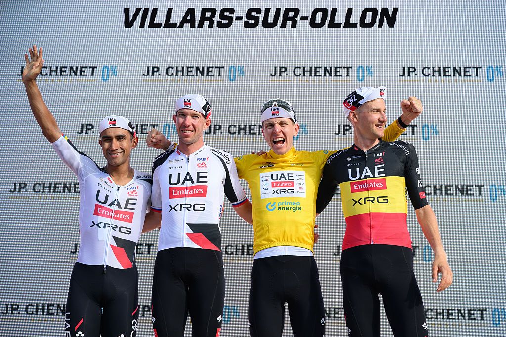 (From L) Team Emirates-XRG's Ecuadorian rider Jhonatan Narvaez, UAE Team Emirates-XRG's Slovenian rider Domen Novak, race winner UAE Team Emirates-XRG's Slovenian rider Tadej Pogacar and UAE Team Emirates-XRG's Belgian rider Tim Wellens celebrate on the podium after the Men's Tour of Switzerland (Tour de Suisse) cycling race, in Villars-sur-Ollon on June 21, 2026. (Photo by Harold Cunningham / AFP)