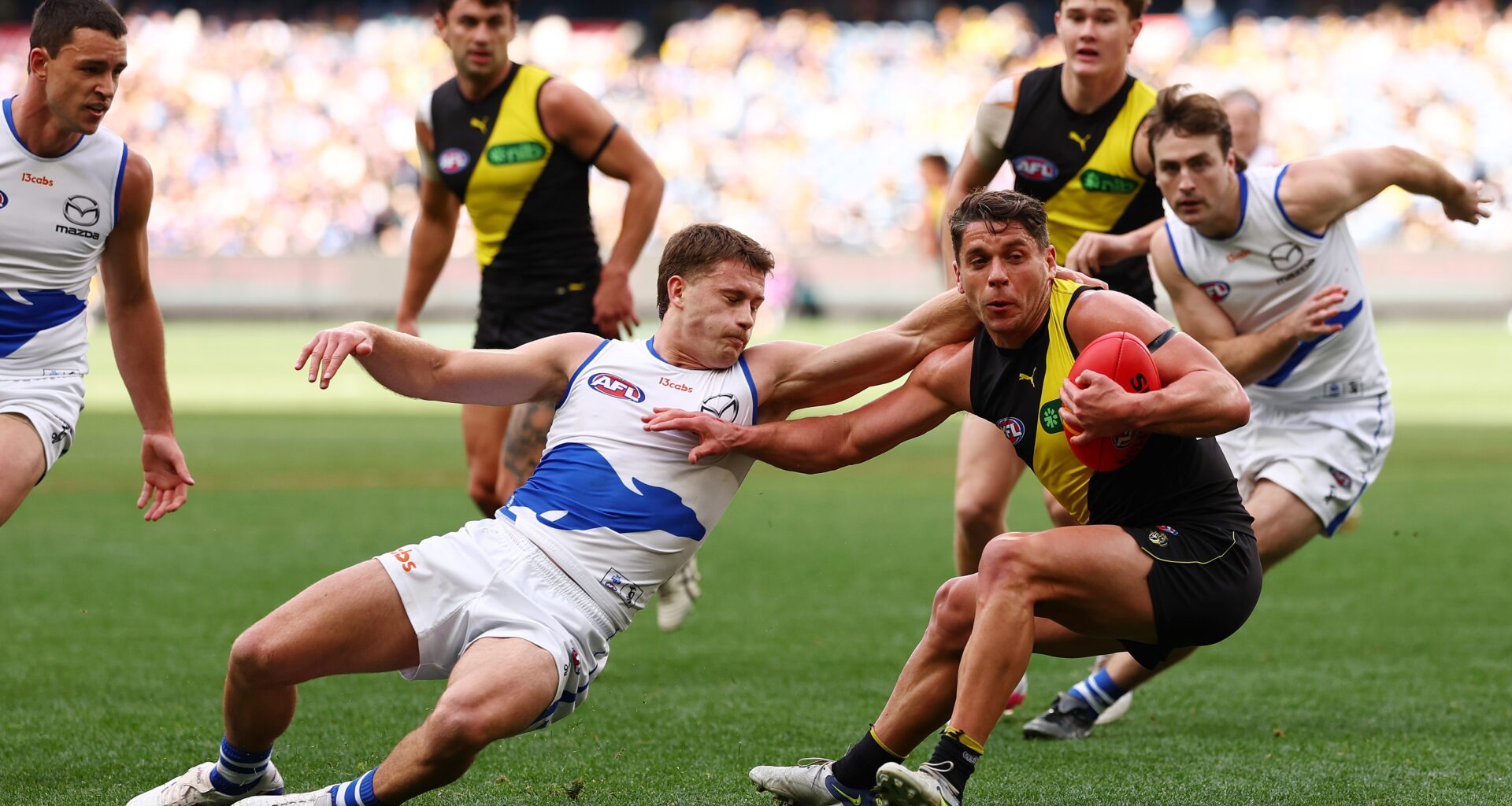 Final teams in as Roos look to build in Tigers clash at the 'G. Follow LIVE