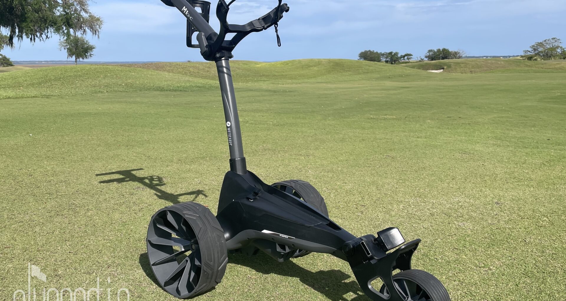 A picture of the Motocaddy M1 DHC electric caddy without a bag on it.