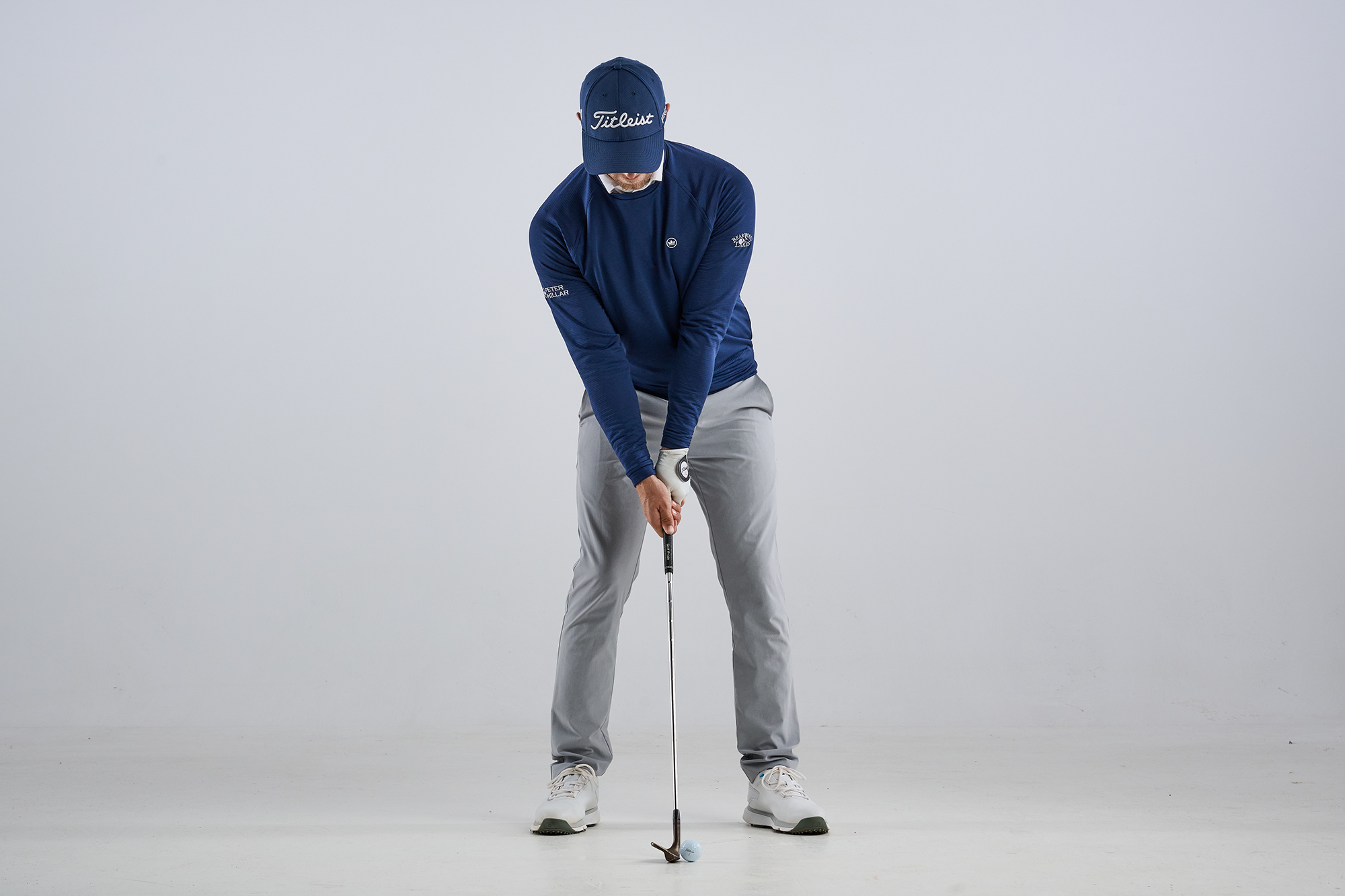 Alex Buckner demonstrating the setup position for a higher-flighted wedge shot