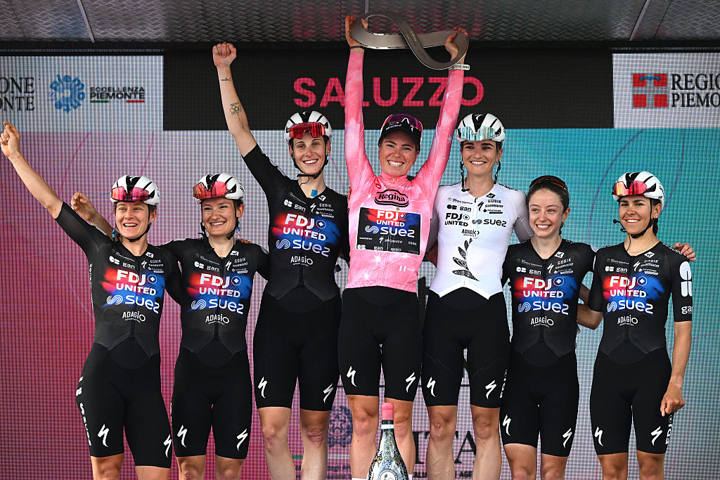 SALUZZO, ITALY - JUNE 07: Final overall race winner Demi Vollering of Netherlands - Pink Leader Jersey (C), Celia Gery of France, Lauren Dickson of Great Britain, Vittoria Guazzini of Italy, Amber Kraak of Netherlands, Eva Van Agt of Netherlands, Ally Wollaston of New Zealand and Team FDJ United - SUEZ celebrate at podium during the 37th Giro d&amp;apos;Italia Women 2026 - Stage 9 a 145km stage from Saluzzo to Saluzzo / #UCIWWT / on June 07, 2026 in Saluzzo, Italy. (Photo by Luc Claessen/Getty Images)