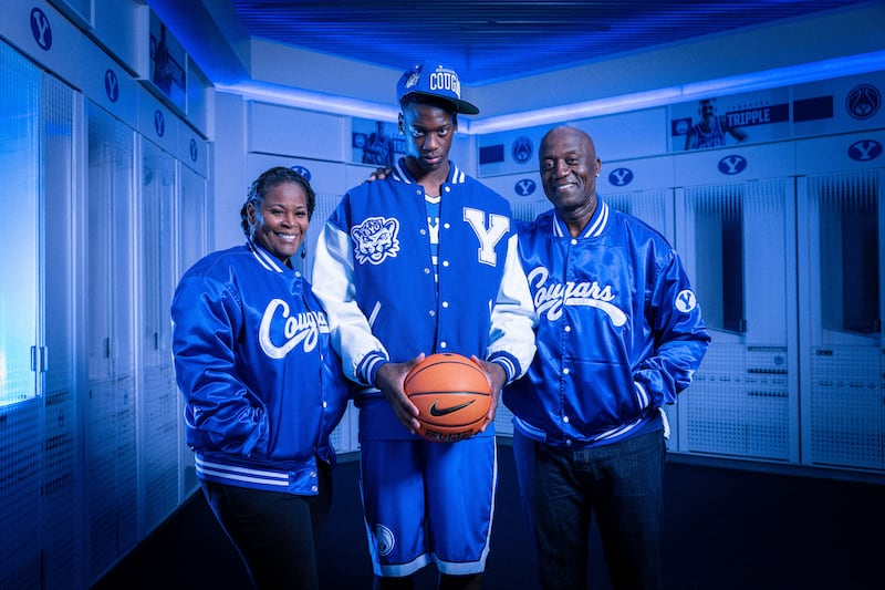 AJ Dybantsa poses for a picture with his parents during a visit to BYU's campus on Oct. 11, 2024.