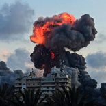 (FILES) A fireball and smoke erupt from a building following an Israeli strike in Tyre, southern Lebanon, on May 28, 2026. The world has settled in a high level of violence with, in 2025, the largest number of state conflicts since the end of World War II and an explosion of attacks directly targeting civilians, according to the annual PRIO Global Conflict Trends report on the trend of conflicts in the world published on June 9, 2026. (Photo by KAWANT HAJU / AFP via Getty Images)