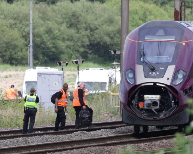 BEDFORD, UNITED KINGDOM - JUNE 20: Officials work at the site of two East Midlands Railway (EMR) trains which crashed into each other in Bedford, United K????ngdom on June 20, 2026. One person has died and several others were injured in a collision involving two passenger trains near Bedford. (Photo by Jacqueline Lawrie/Anadolu via Getty Images)