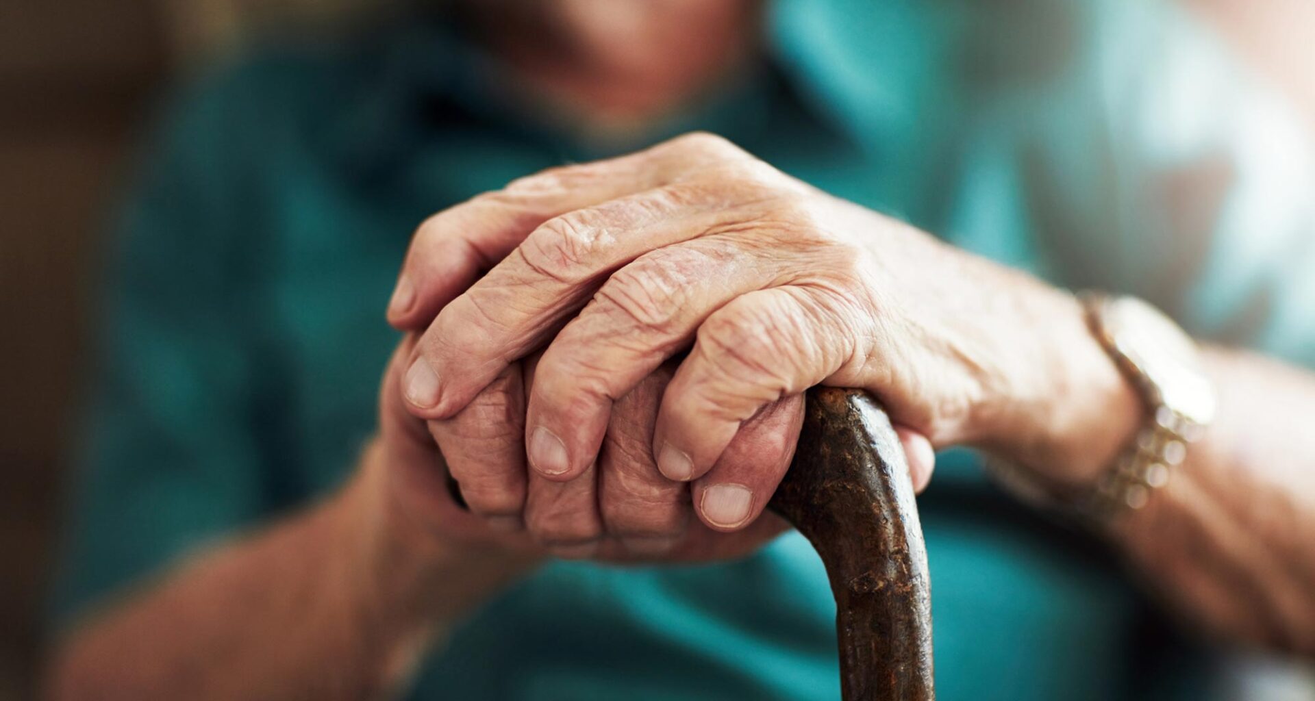 Senior Man Holding Walking Cane