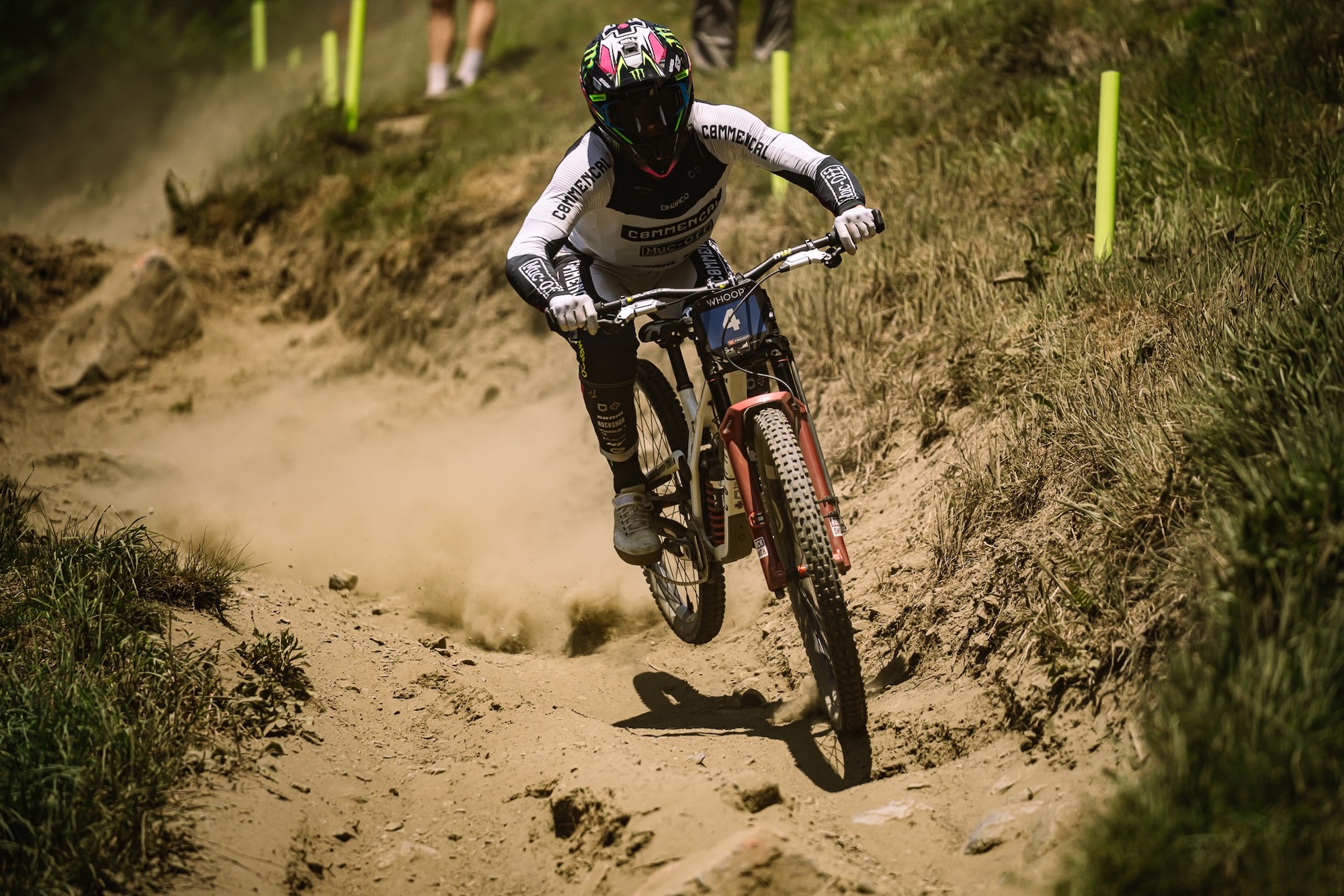 a rider on the Supreme DH V5.2 riding a rough downhill trail