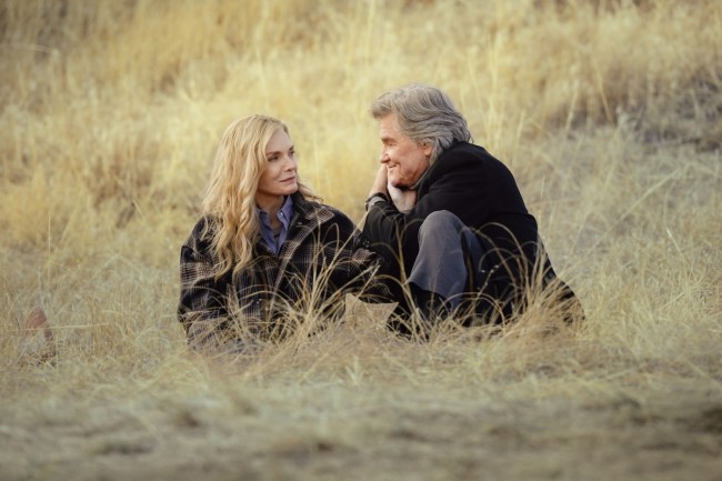 'The Madison' stars Michelle Pfeiffer as Stacy Clyburn and Kurt Russell as Preston Clyburn, shown here sitting in a golden field, smiling at each other