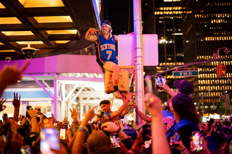Knicks fans celebrate outside Madison Square Garden in New York after their team advanced to the NBA finals. Photograph: Vincent Alban/The New York Times