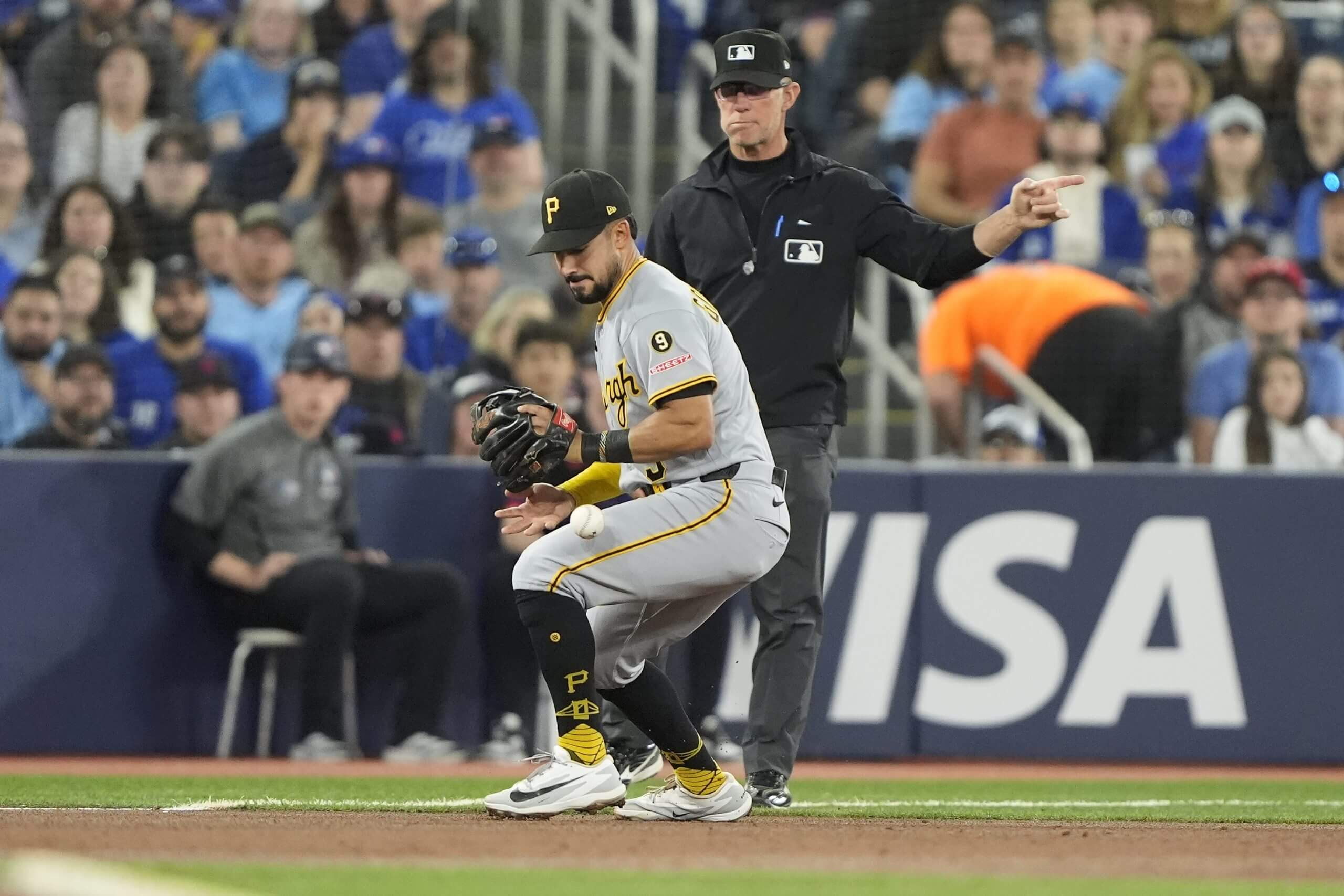 Pittsburgh Pirates third baseman Nick Gonzales (3) bobbles a ground ball hit by Toronto Blue Jays second baseman Ernie Clement (not pictured) during the second inning at Rogers Centre.
