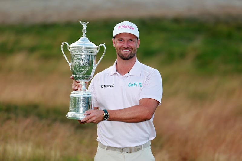 Wyndham Clark celebrates with the US Open trophy after his victory at Shinnecock Hills. Photograph: Andrew Redington/Getty Images