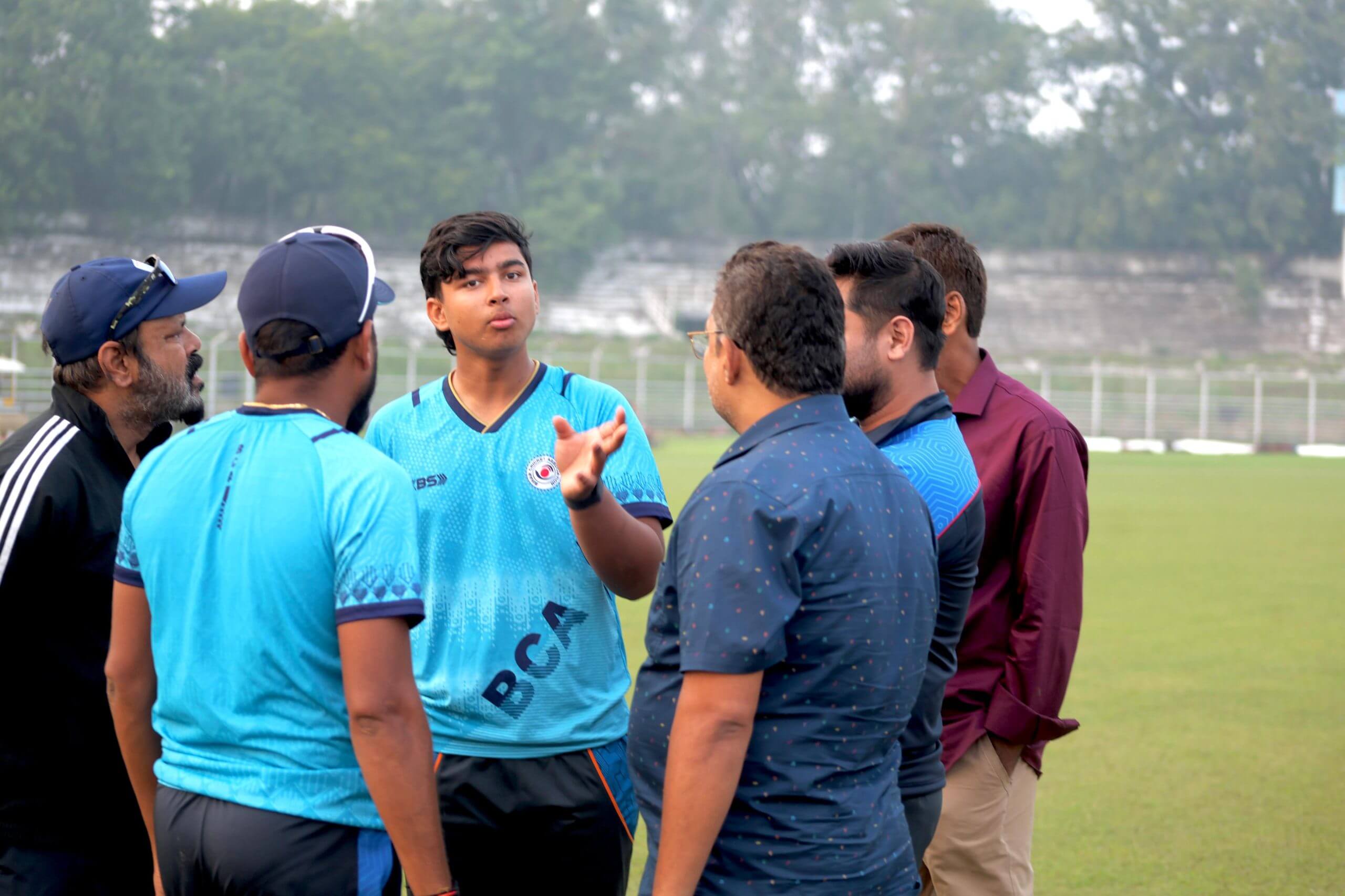 Vaibhav Sooryavanshi in conversation with coaches and trainers at the cricket academy in Bihar