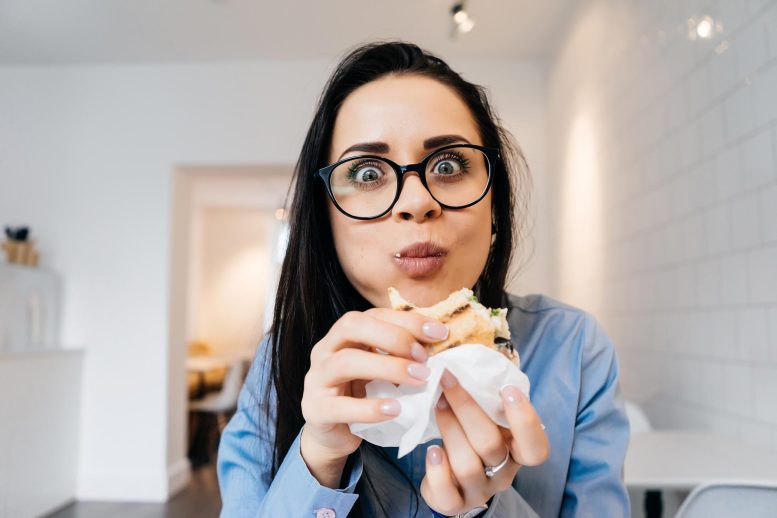 Woman Eating Sandwich
