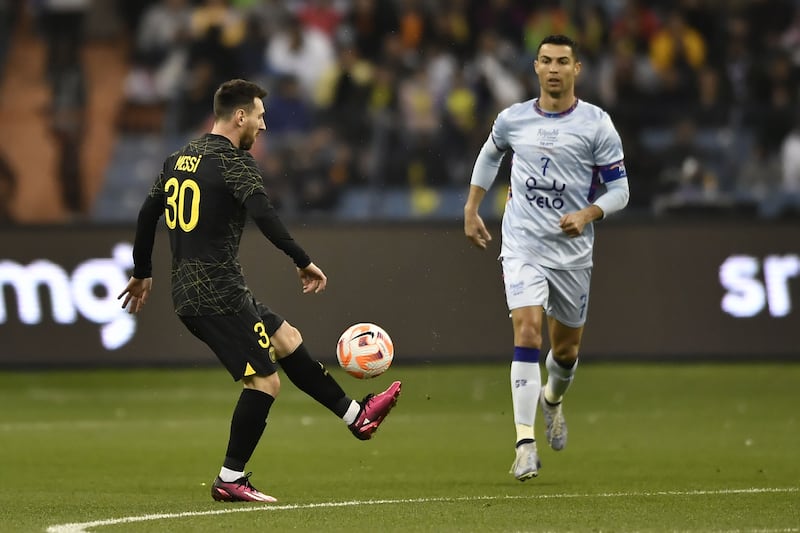 Lionel Messi of PSG in action against Cristiano Ronaldo of Riyadh XI in January 2023. Photograph: EPA