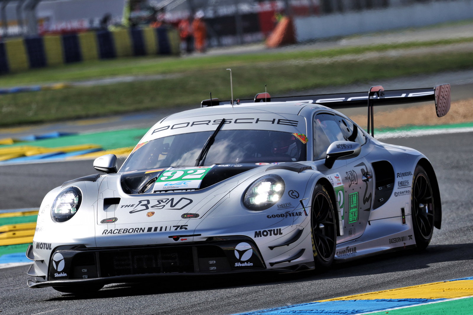 The #92 Manthey Racing Porsche 911 GT3 R driven by Yasser Shahin on track at Le Mans.