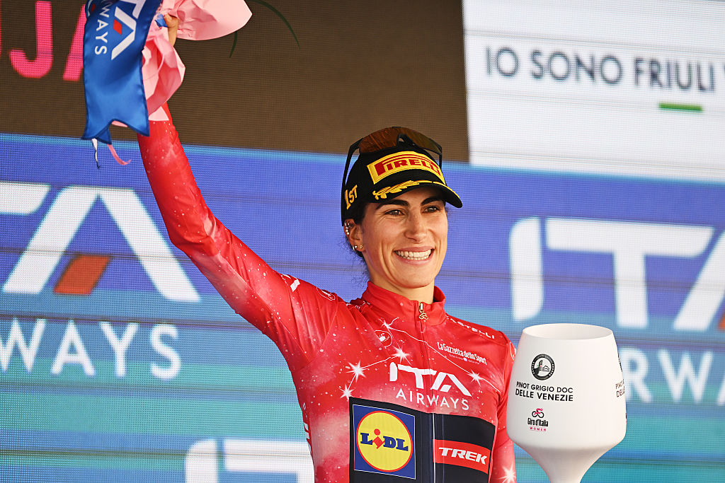 Elisa Balsamo (Lidl - Trek) in the red jersey on the podium after stage 3 of the 2026 Giro d'Italia Women in Buja, Italy. (Photo by Luc Claessen/Getty Images)