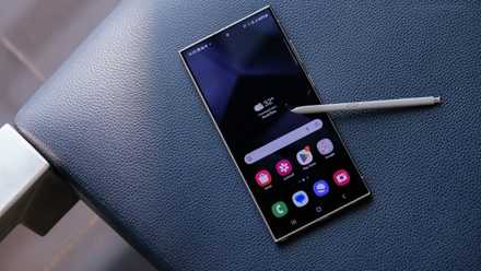 A Galaxy S24 Ultra with the S Pen on the edge of a seat